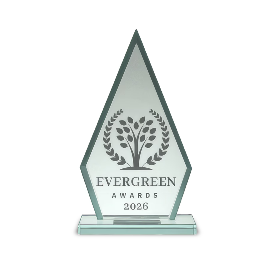Glass award trophy with a tall diamond shape, etched tree and laurel design, “Evergreen Awards 2026.”