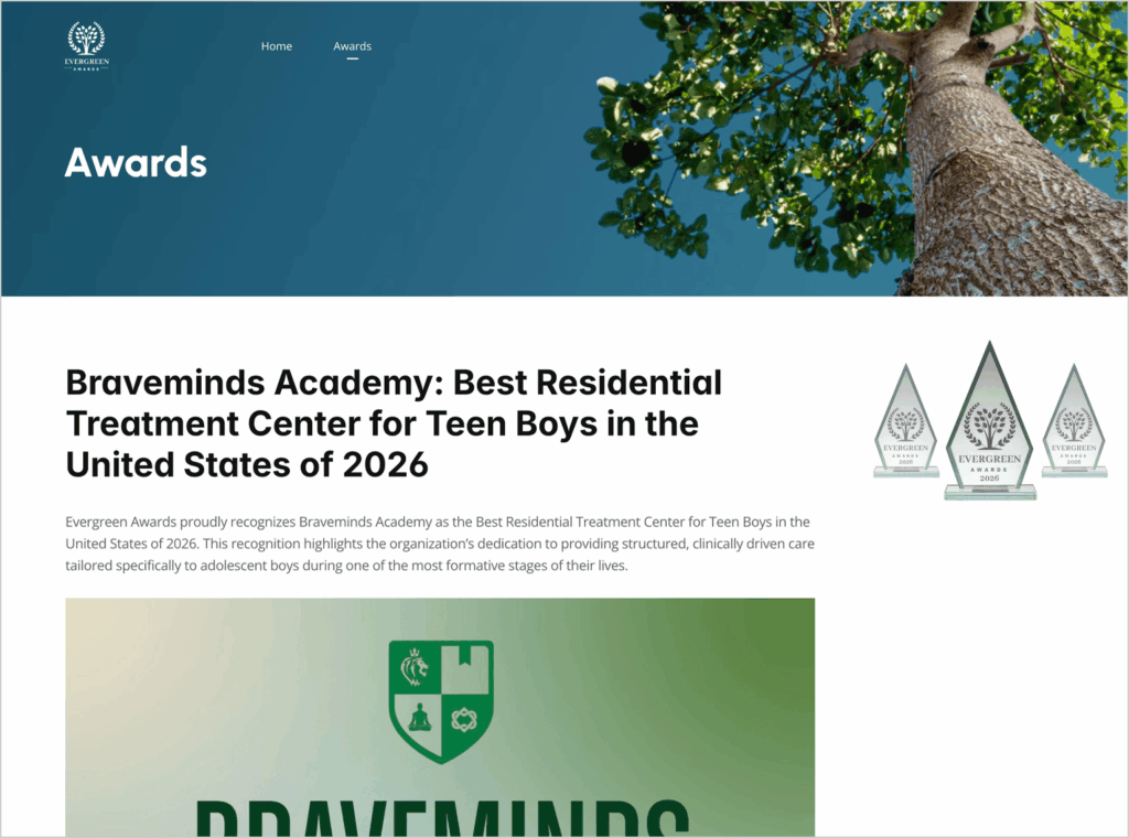 Awards page header with blue gradient, tree trunk on right, and large title text underneath.