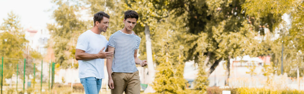 a teen in nature with dad as a summer activity
